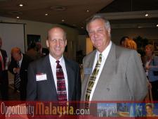 Ken Haiko speaks with Douglas EverettKen Haiko, Vice Chair of Florida Space Authority, , Douglas Everett, President of Greater Pompnao Beach Chamber of Commerce.
