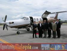 Executive Airport Fort Lauderdale, July 20th 2004.From left to right: Digital Media Network sponsored the event and transported the team to The Florida Space Authority. From Left to Right; Thomas Bernthaler Co-pilot and CTO of Digital Media Network, Bernhard Schutte Chairman of Asia Committee USA, Jim Tarlton President of the Broward Alliance, Chris Pollock, President of The Greater Fort Lauderdale Chamber of Commerce, Michael Corbit Executive Director of the Internet Coast, and John McCartney Director of the US Dep. of Commerce for Florida.