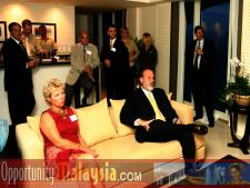 Bernhard Schutte, Chairman of Asia Committee USA, giving an audio visual live Internet presentation about Opportunities in Malaysia. This is some of the business leaders that attended.  Front row from left to right: June Wolfe, President or South Florida Manufacturers Association and Jim Tarlton, President & CEO of the Broward Alliance. Back row from left to right: Gary Press, (Publisher) South Florida Business Journal, Consul John Bauer, President of Basic Food International, Thomas Bernthaler, CIO of Digital Media Network(DMNI) and Chris Cronje, President & CEO of Alpine Engineered Products.